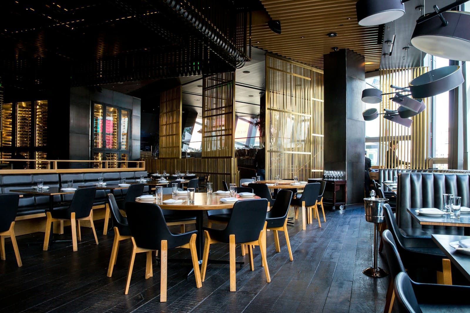 Guests dining in an independent restaurant with warm lighting